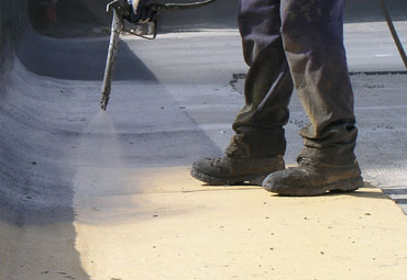 Coating systems over Birmingham spray foam roof systems